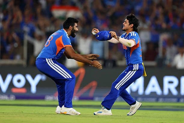 Teammates congratulate Jasprit Bumrah after another match-winning performance.